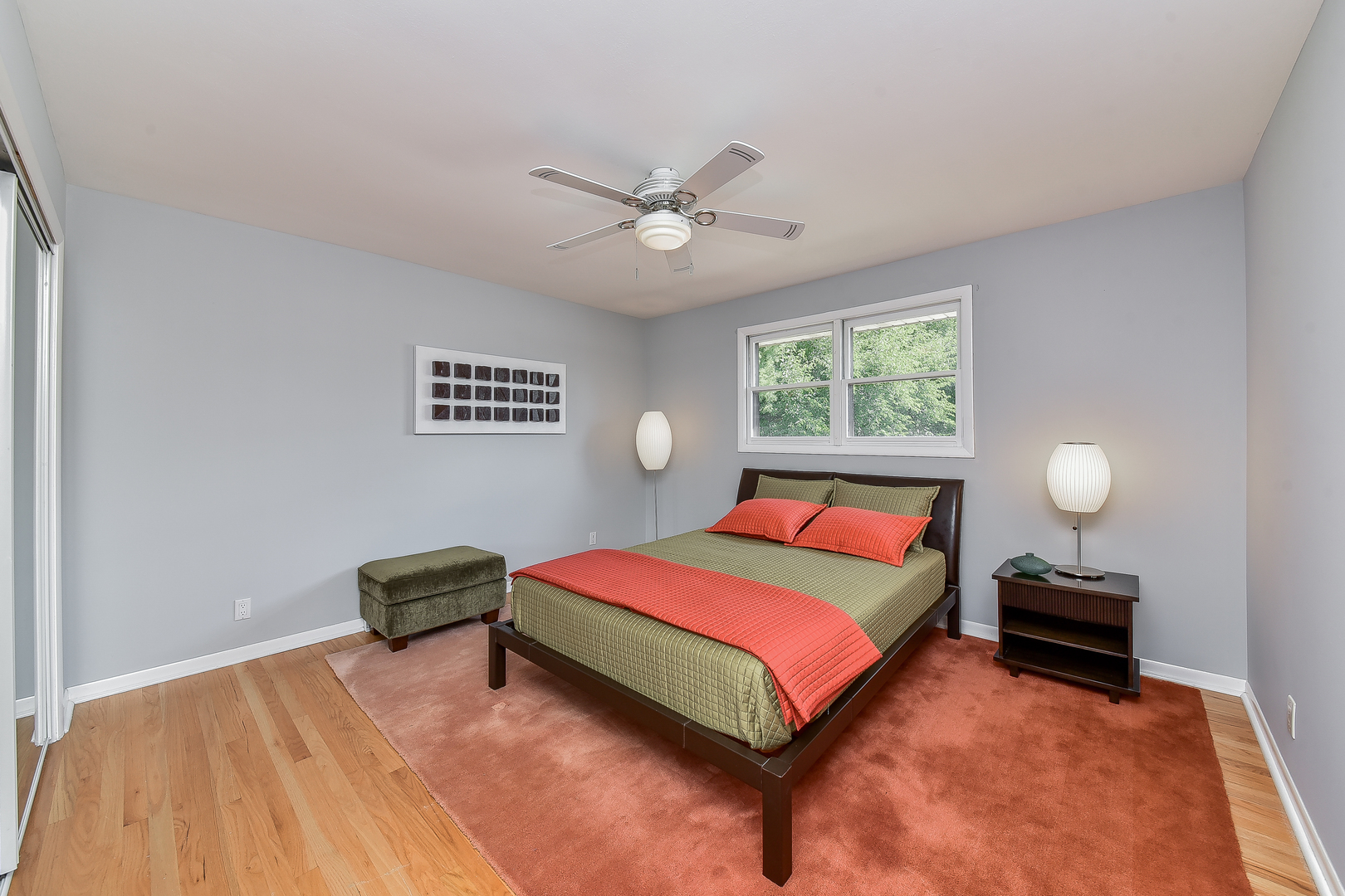 8645 Brookridge Road Downers Grove, IL 60516 - Photo 12 of 23 a bedroom with a bed and a chandelier