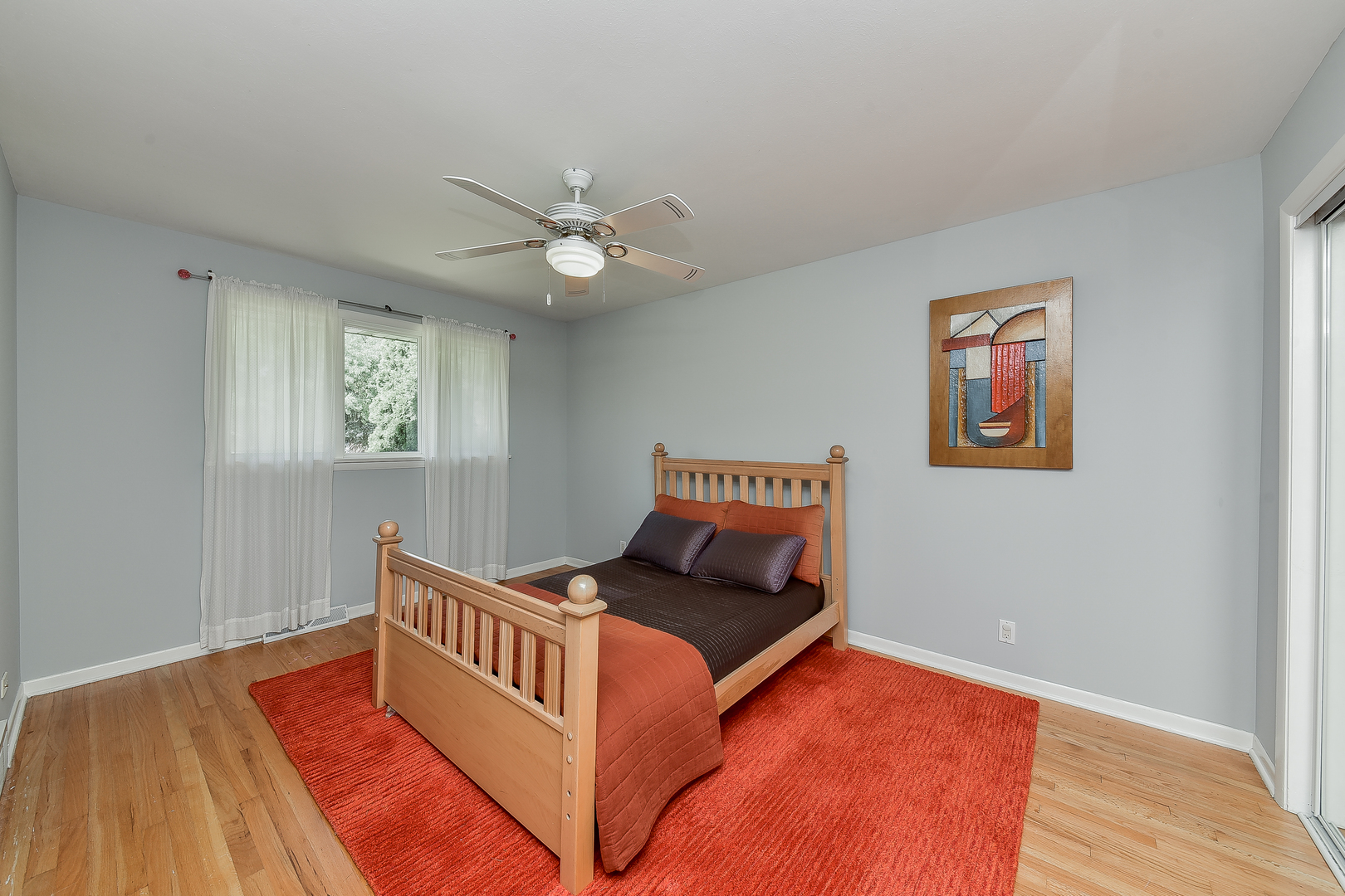 8645 Brookridge Road Downers Grove, IL 60516 - Photo 14 of 23 a bed room with a bed and a window