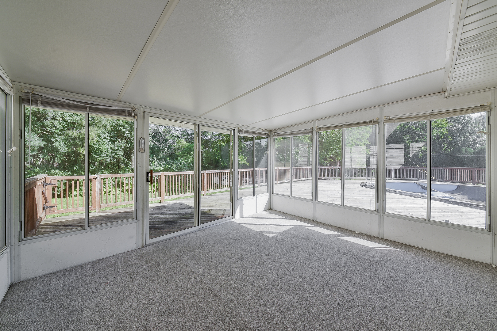 8645 Brookridge Road Downers Grove, IL 60516 - Photo 19 of 23 a view of an empty room with wooden floor and windows