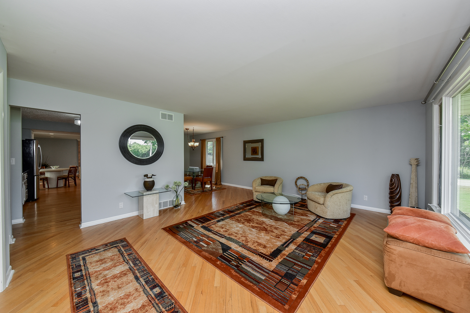 8645 Brookridge Road Downers Grove, IL 60516 - Photo 3 of 23 a living room with furniture and a rug