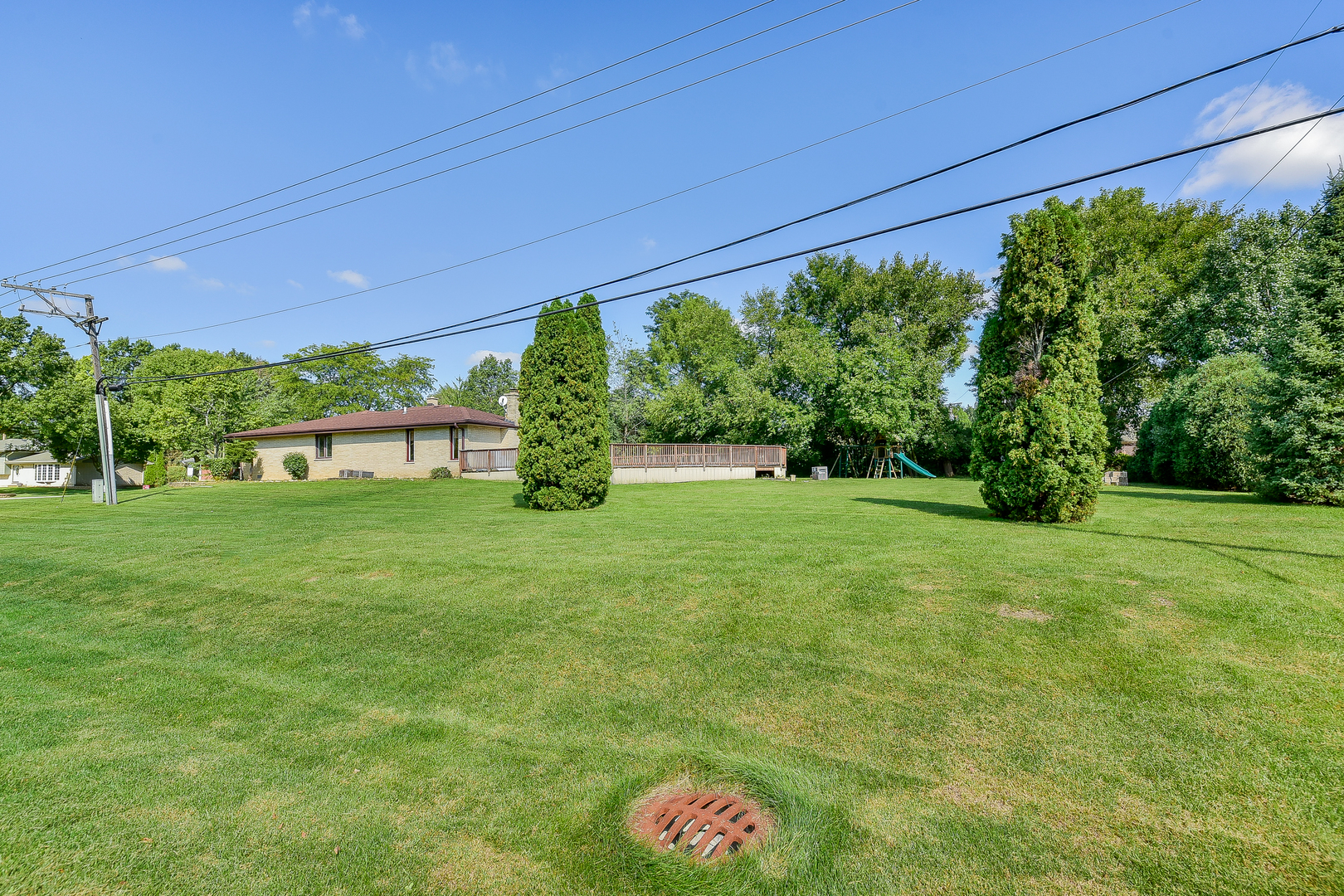 8645 Brookridge Road Downers Grove, IL 60516 - Photo 23 of 23 a view of a house with a backyard