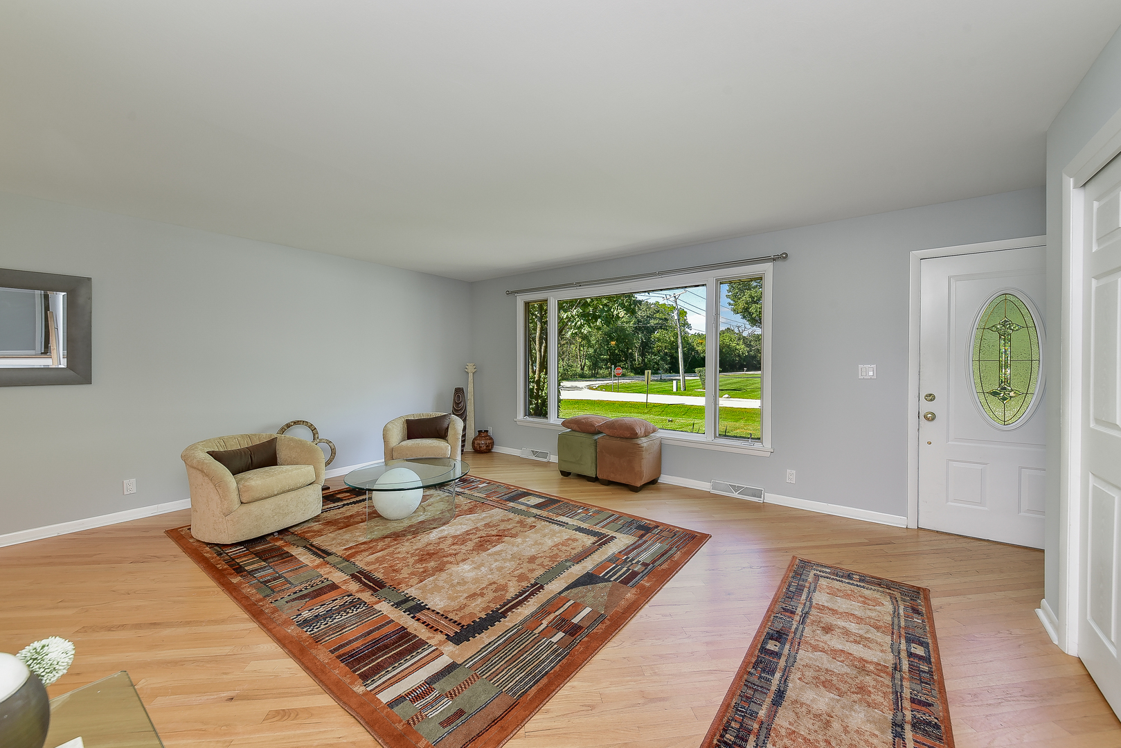 8645 Brookridge Road Downers Grove, IL 60516 - Photo 4 of 23 a living room with furniture and a rug