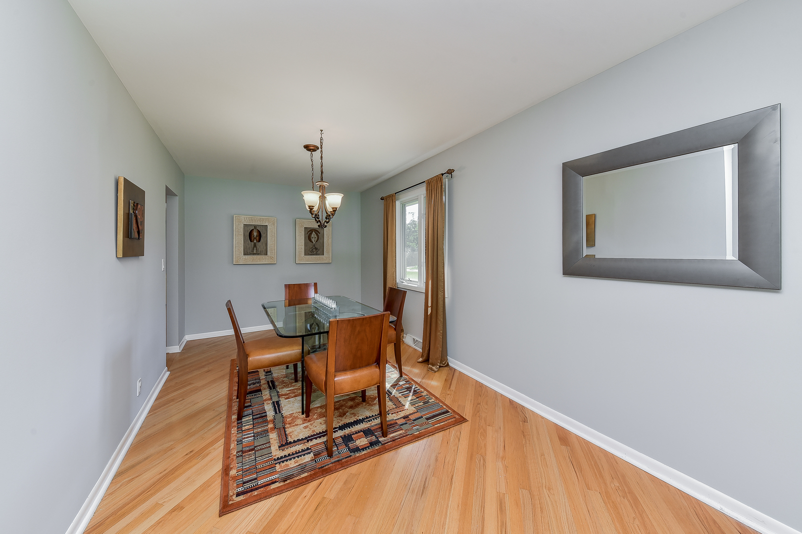8645 Brookridge Road Downers Grove, IL 60516 - Photo 7 of 23 a living room with furniture and a table