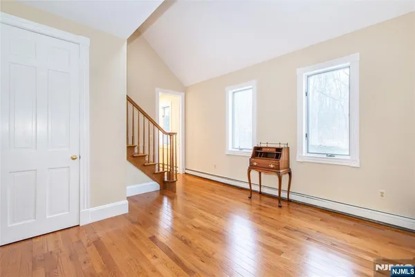 a view of an entryway with wooden floor