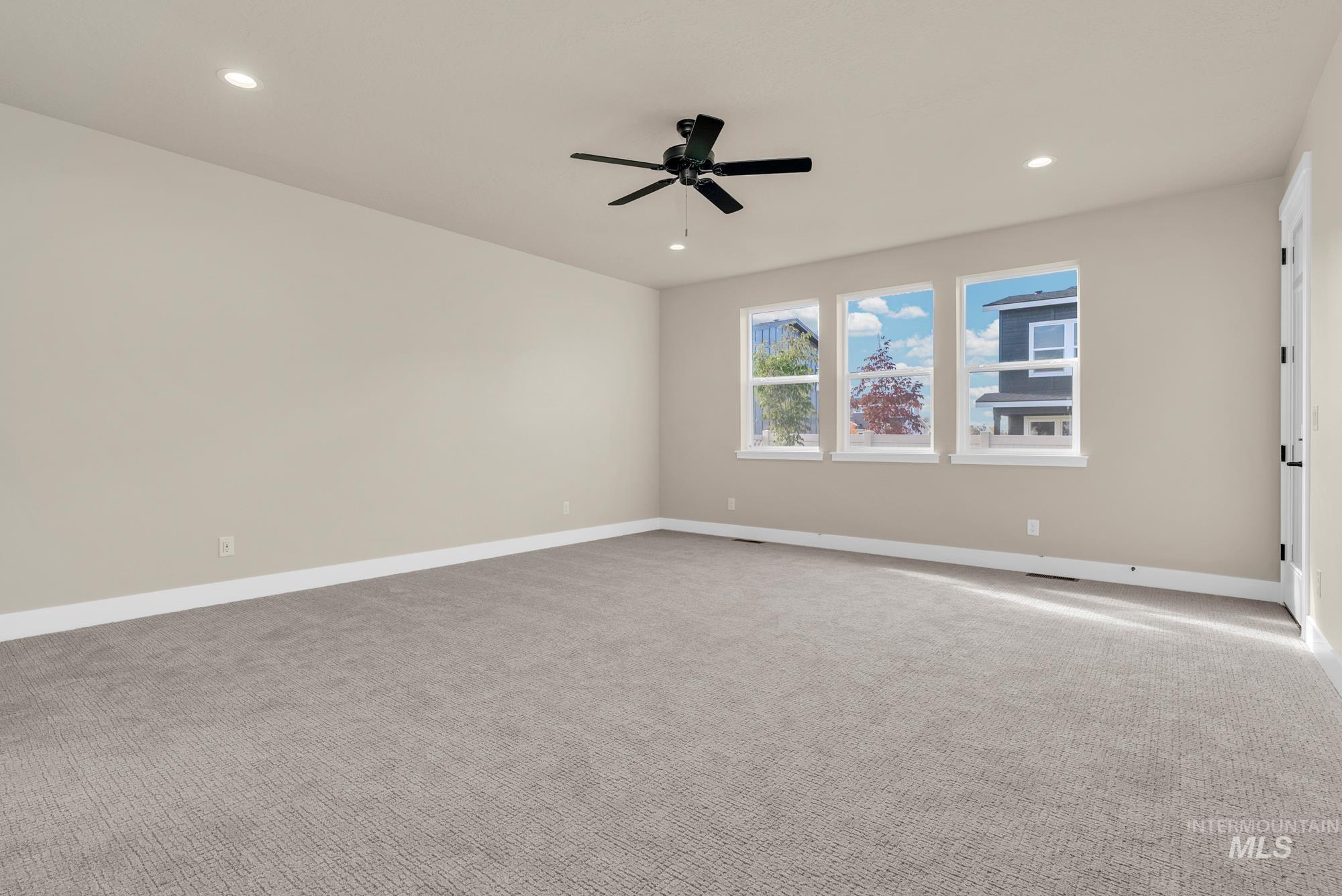2772 West Jutland Street Meridian, ID 83642 - Photo 10 of 25 Spare room featuring carpet, recessed lighting, and ceiling fan