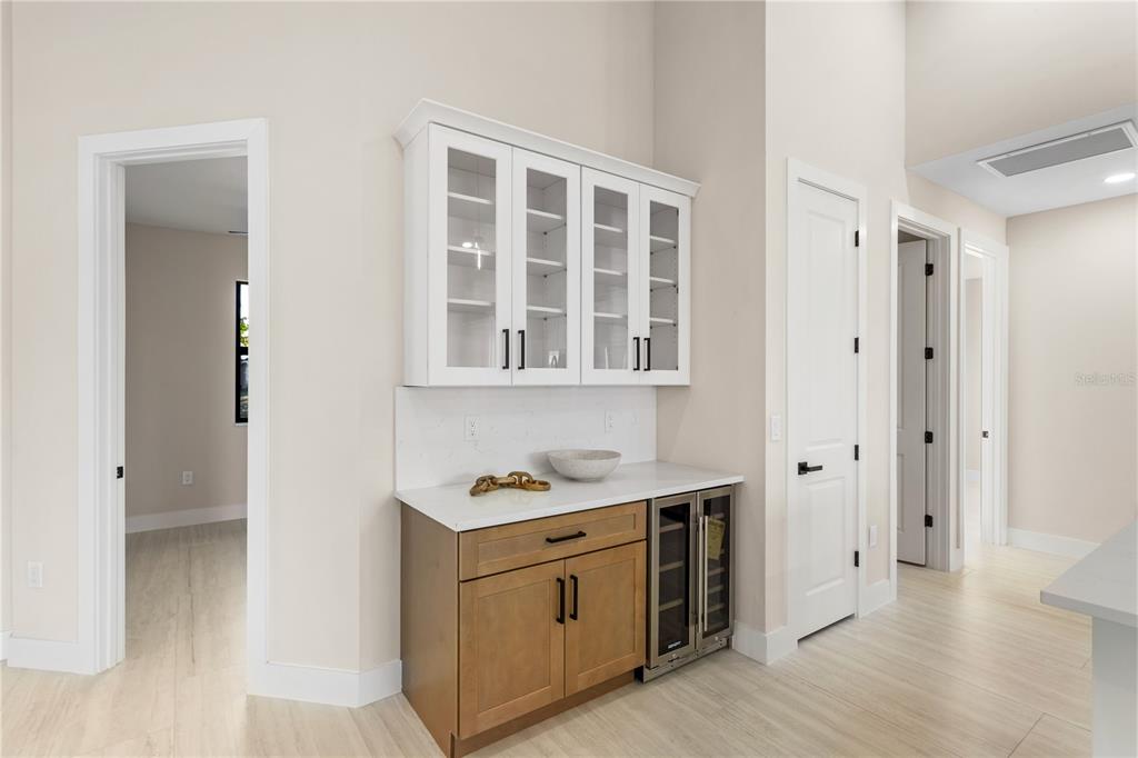 1711 Southwest 3rd Street Cape Coral, FL 33991 - Photo 15 of 45 a kitchen with stainless steel appliances a stove microwave and a refrigerator