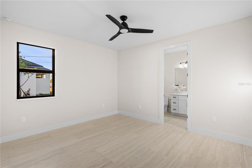 1711 Southwest 3rd Street Cape Coral, FL 33991 - Photo 40 of 45 a view of a room with a painting on the wall