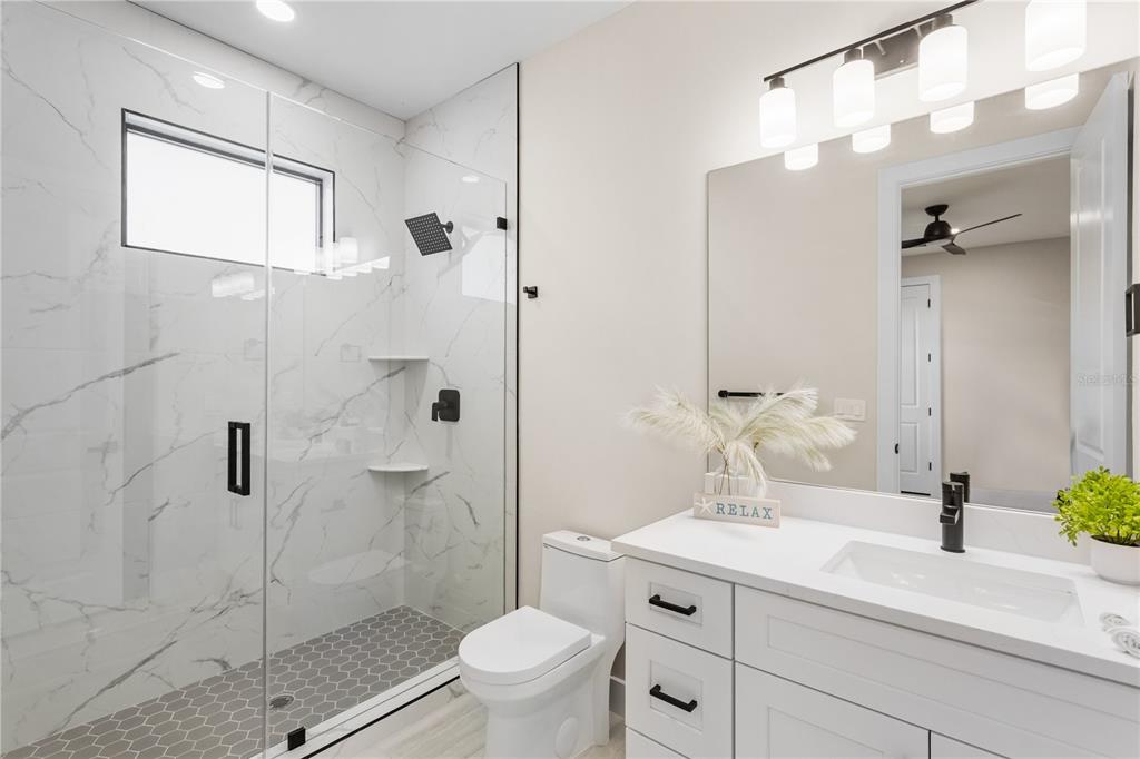 1711 Southwest 3rd Street Cape Coral, FL 33991 - Photo 41 of 45 a bathroom with a sink toilet and shower