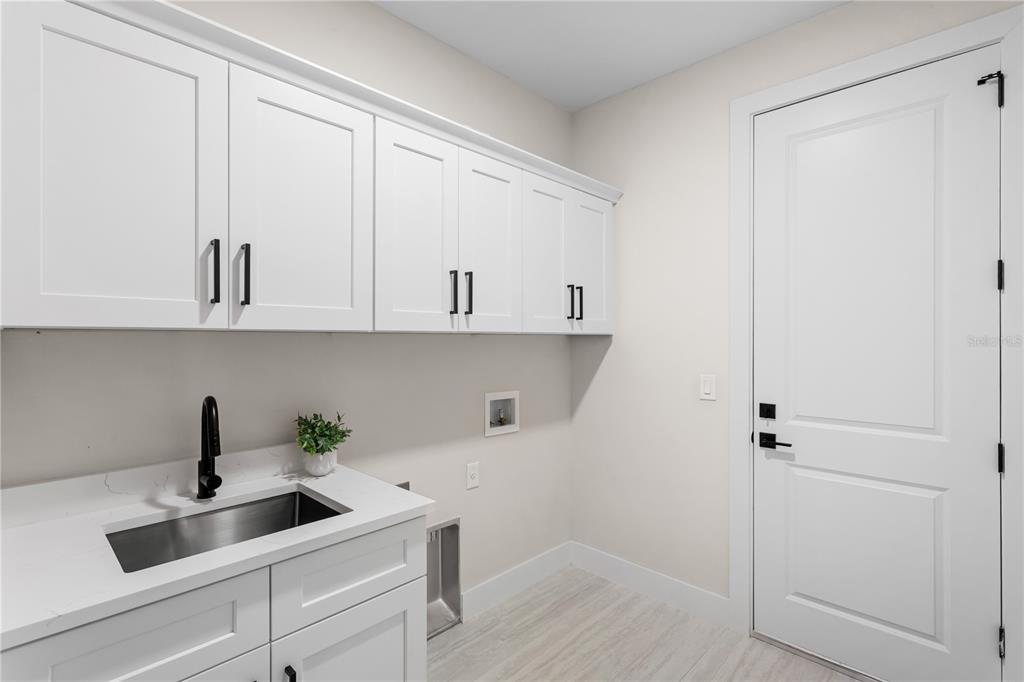 1711 Southwest 3rd Street Cape Coral, FL 33991 - Photo 43 of 45 a view of cabinets and wooden floor