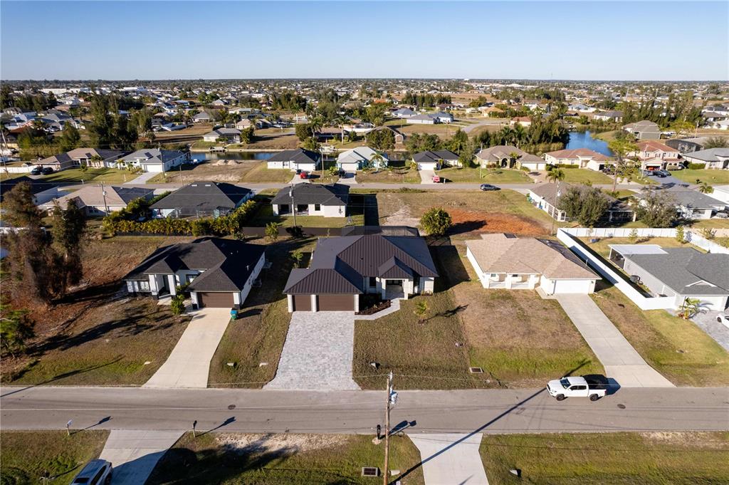 1711 Southwest 3rd Street Cape Coral, FL 33991 - Photo 44 of 45 an aerial view of residential houses with outdoor space