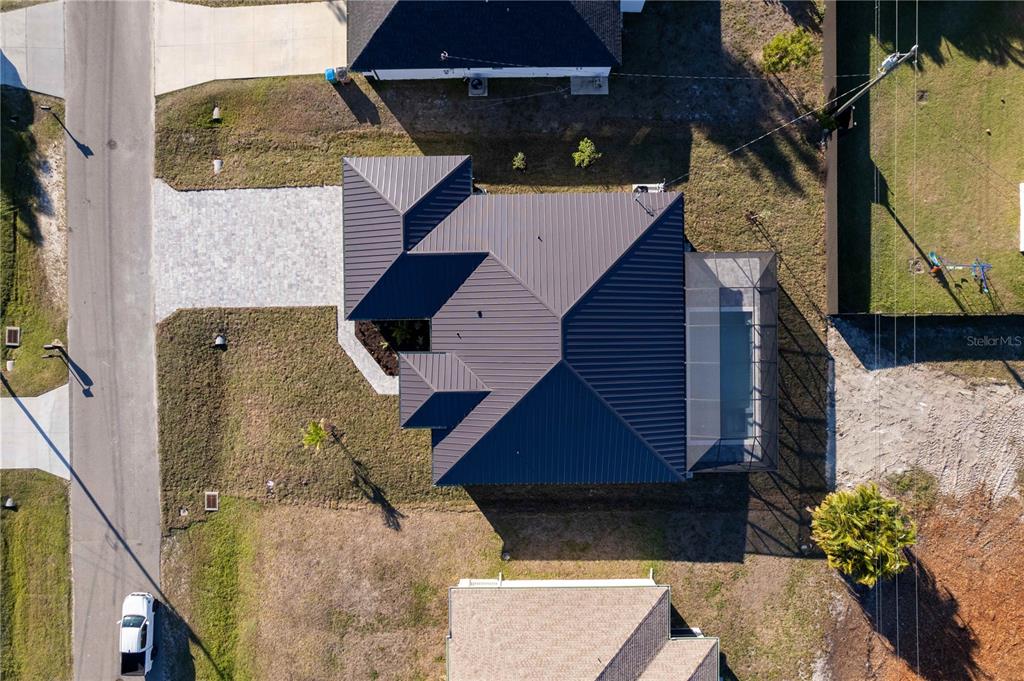 1711 Southwest 3rd Street Cape Coral, FL 33991 - Photo 6 of 45 a aerial view of a house with a yard