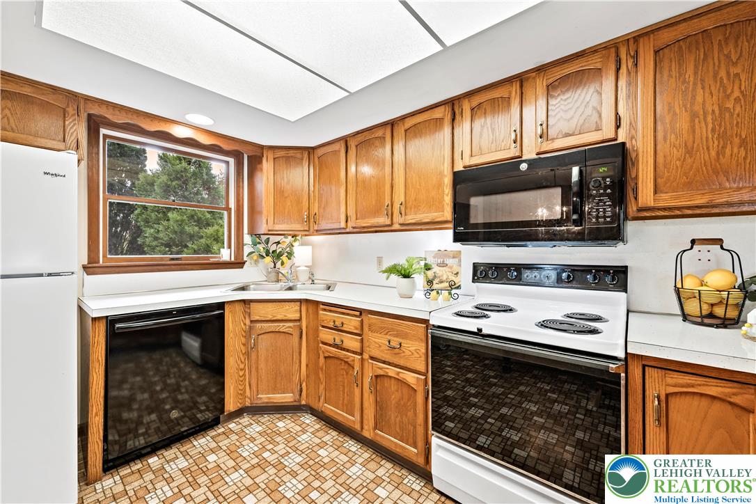 7509 Borman Road New Tripoli, PA 18066 - Photo 14 of 41 a kitchen with a stove a sink and a microwave