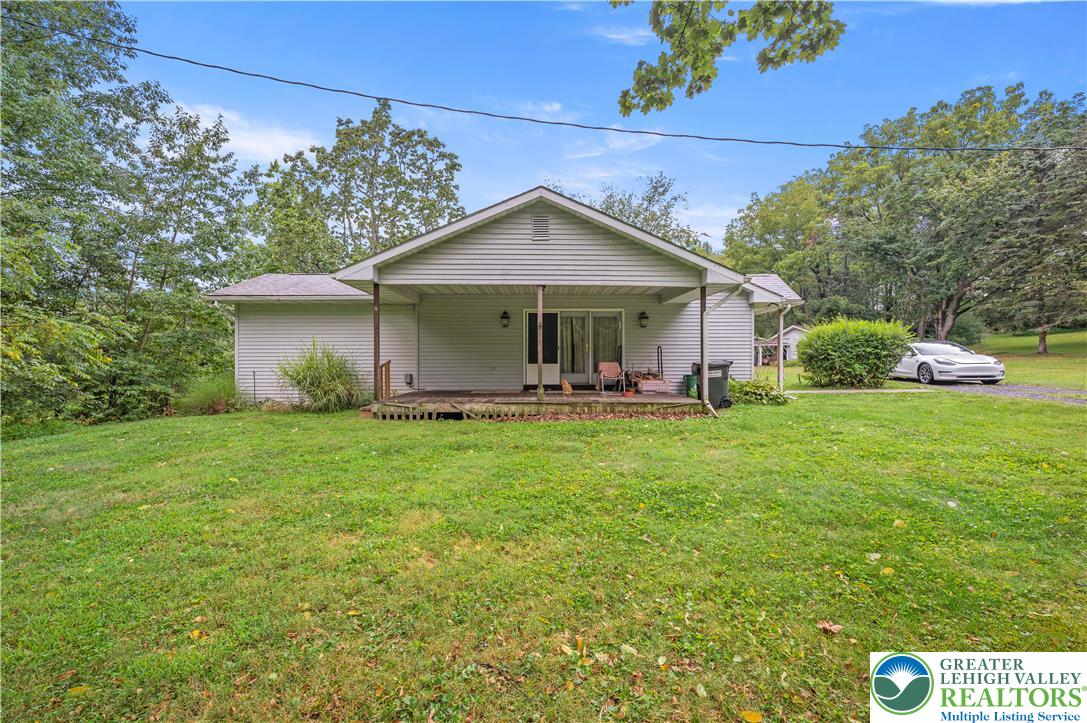 7509 Borman Road New Tripoli, PA 18066 - Photo 3 of 41 a front view of house with yard and green space