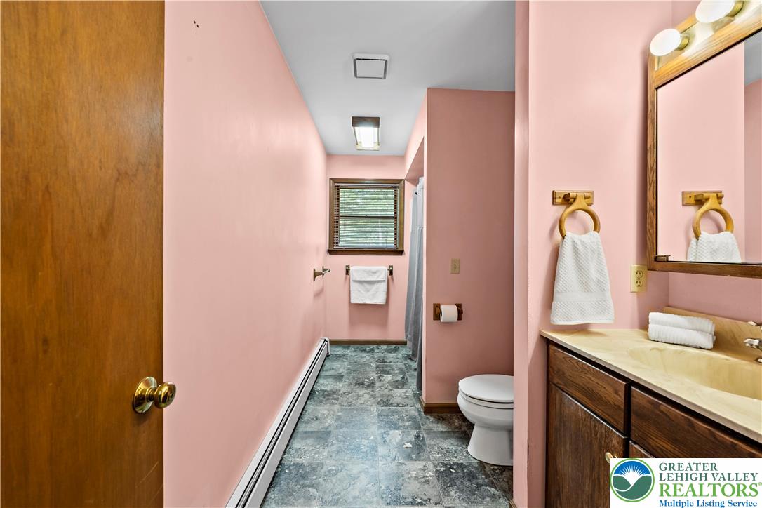 7509 Borman Road New Tripoli, PA 18066 - Photo 31 of 41 a bathroom with a granite countertop sink toilet and shower