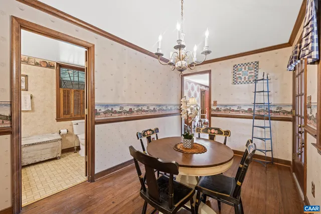 a kitchen with a sink window and cabinets