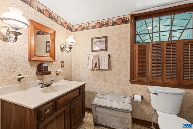 a kitchen with a refrigerator a stove top oven a sink and dishwasher a oven with wooden floor