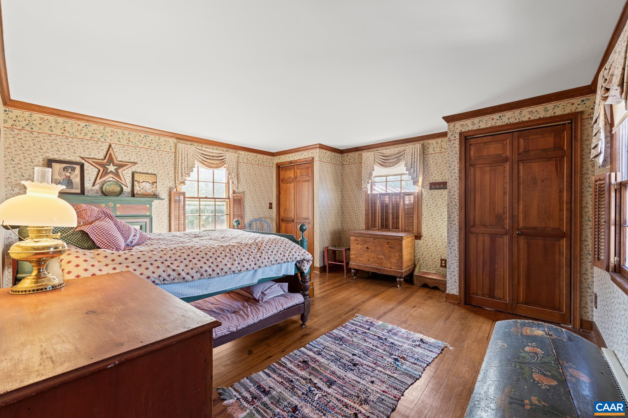 9290 Old Green Mountain Road Esmont, VA 22937 - Photo 33 of 54 a bed room with a bed and a couch