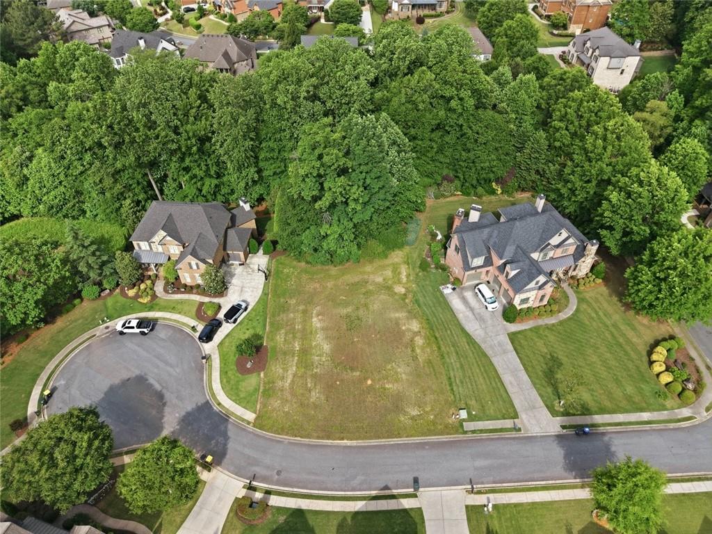 3820 Yaupon Way Cumming, GA 30040 - Photo 1 of 15 an aerial view of a swimming pool