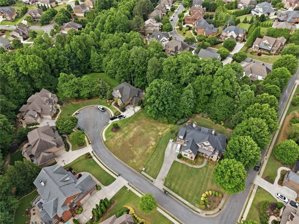 3820 Yaupon Way Cumming, GA 30040 - Photo 11 of 15 an aerial view of a house with a yard and garden