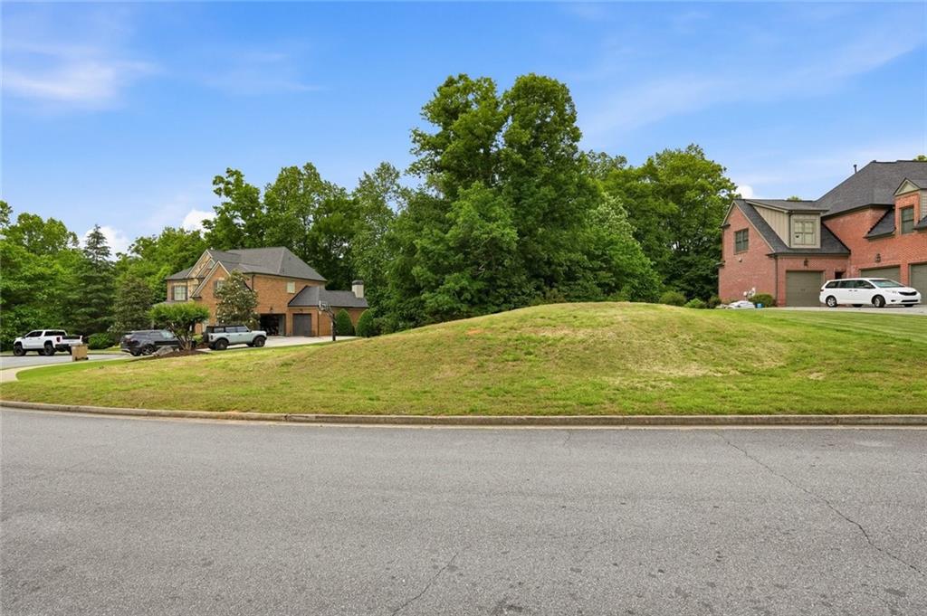 3820 Yaupon Way Cumming, GA 30040 - Photo 14 of 15 a house with trees in the background