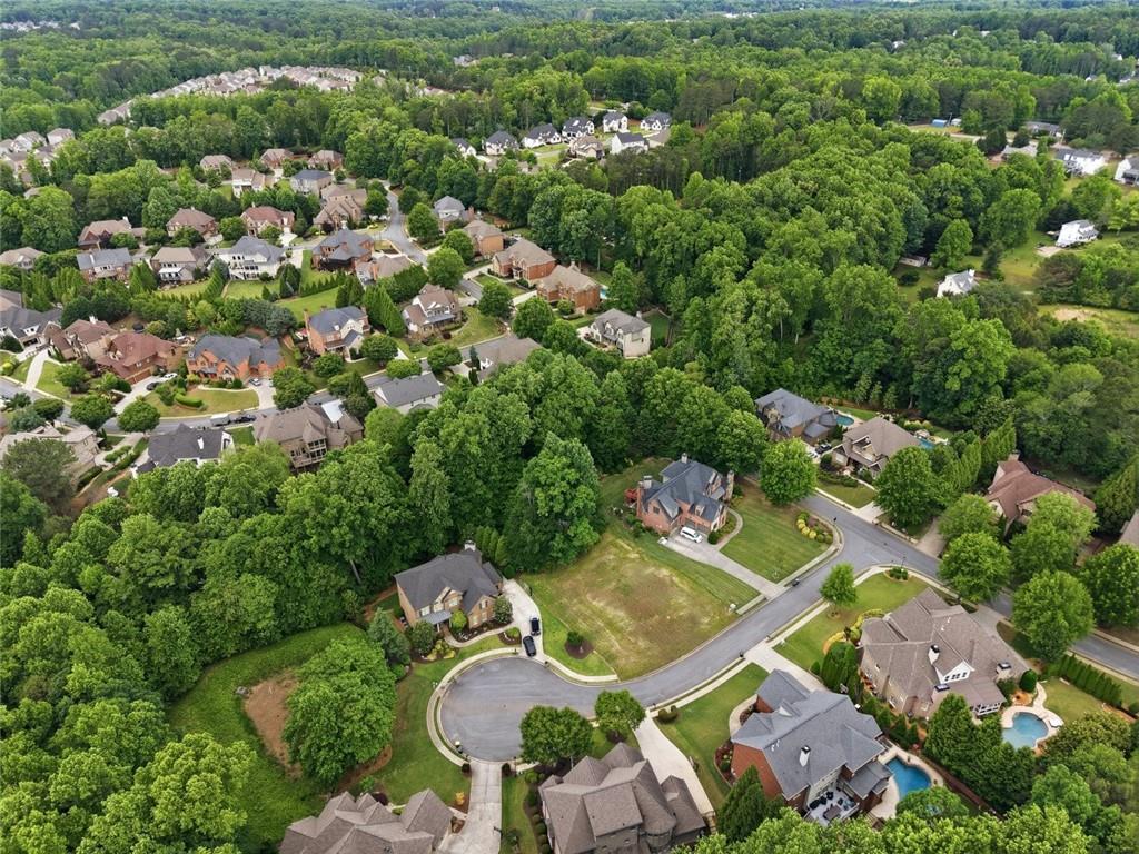 3820 Yaupon Way Cumming, GA 30040 - Photo 7 of 15 an aerial view of a house with yard swimming pool and outdoor seating