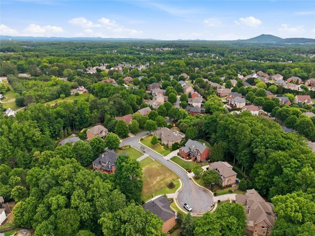 3820 Yaupon Way Cumming, GA 30040 - Photo 10 of 15 an aerial view of residential houses with outdoor space and trees