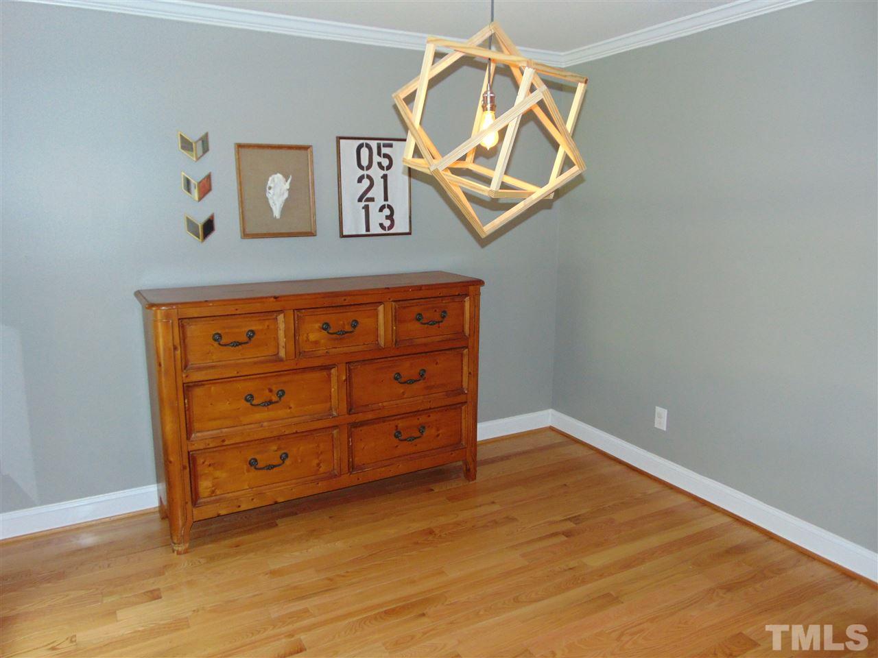 116 Crosspine Drive Raleigh, NC 27603 - Photo 12 of 21 an empty room with wooden cabinet