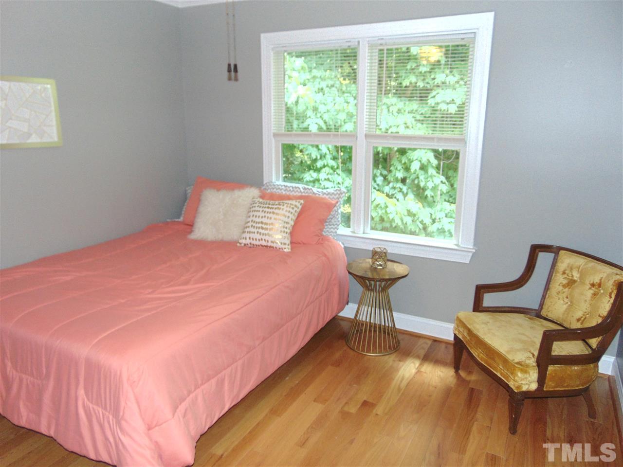 116 Crosspine Drive Raleigh, NC 27603 - Photo 19 of 21 a bedroom with a bed chair and window
