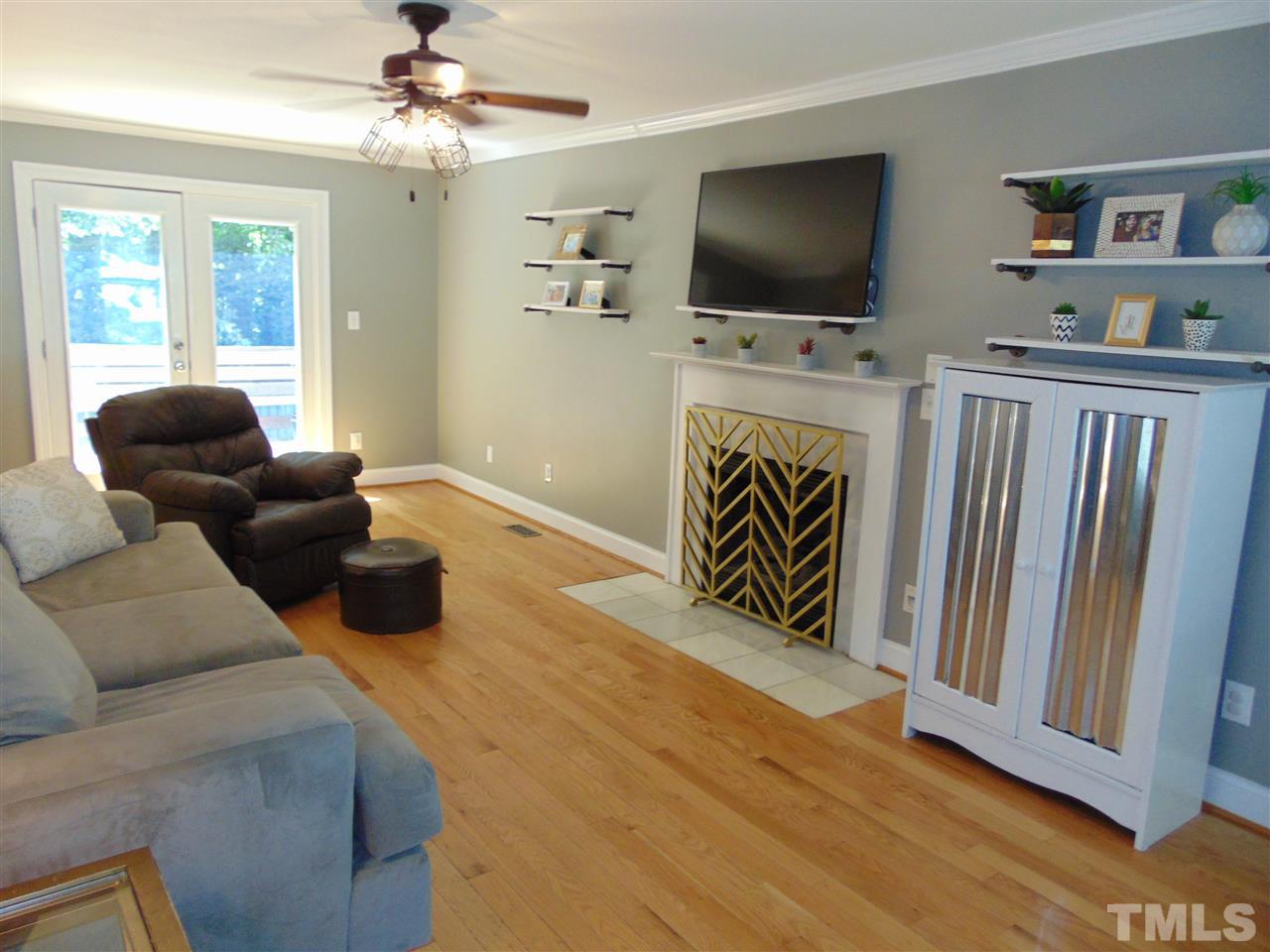 116 Crosspine Drive Raleigh, NC 27603 - Photo 4 of 21 a living room with furniture and a flat screen tv