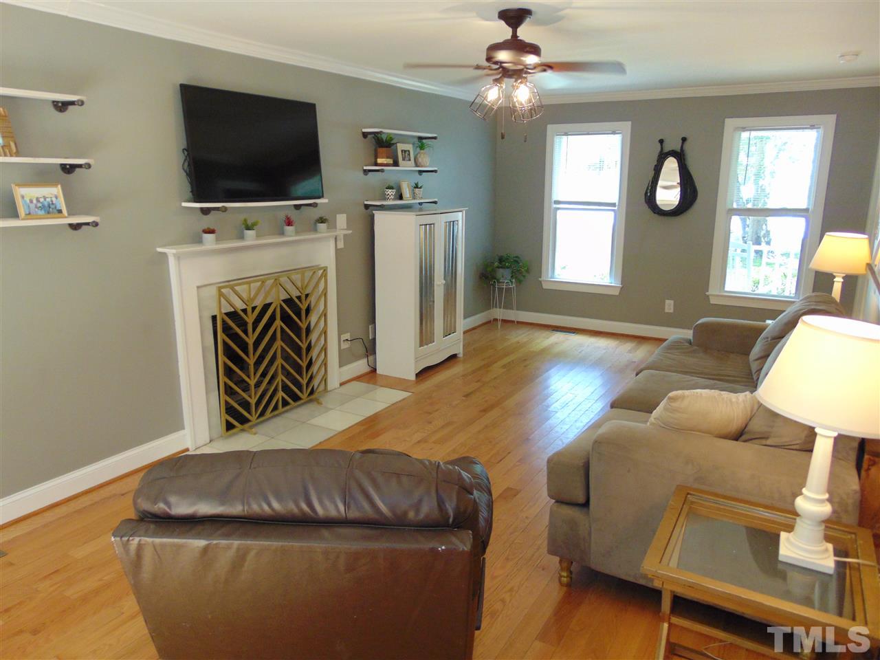 116 Crosspine Drive Raleigh, NC 27603 - Photo 6 of 21 a living room with furniture and a flat screen tv
