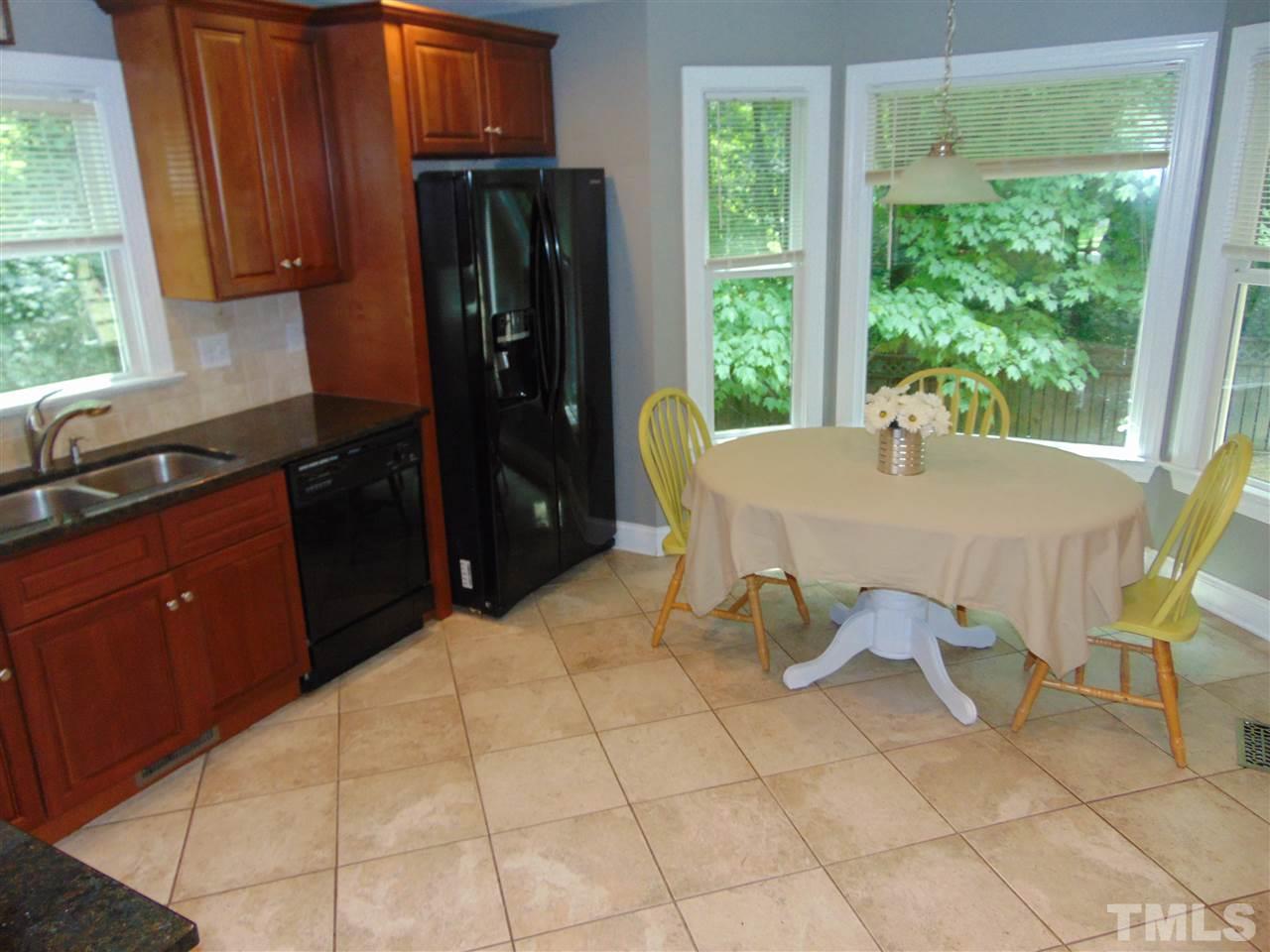 116 Crosspine Drive Raleigh, NC 27603 - Photo 10 of 21 a kitchen with stainless steel appliances granite countertop a refrigerator and a sink