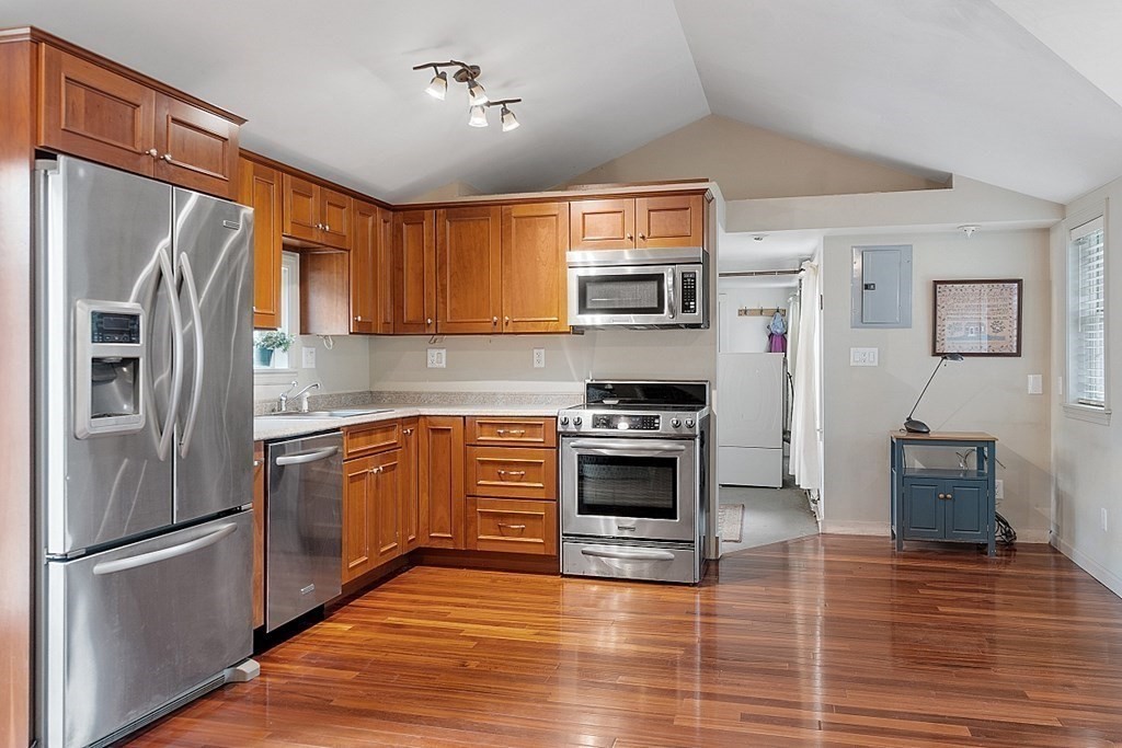 7 Groton-Shirley Road Ayer, MA 01432 - Photo 16 of 42 a kitchen with stainless steel appliances a refrigerator stove and microwave