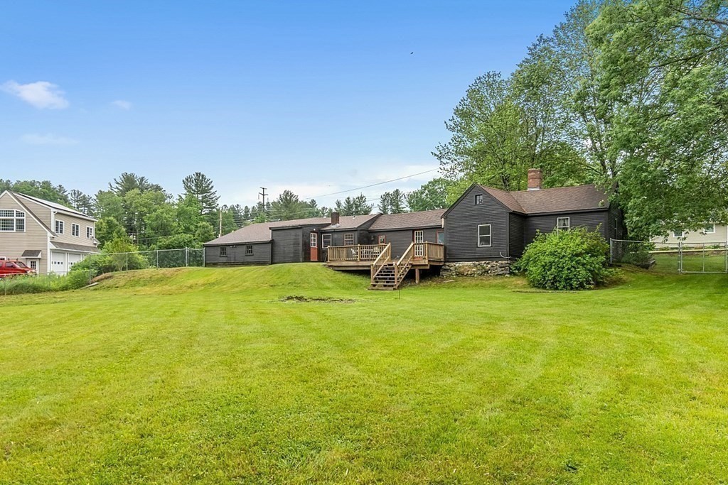 7 Groton-Shirley Road Ayer, MA 01432 - Photo 33 of 42 a view of a house with a backyard