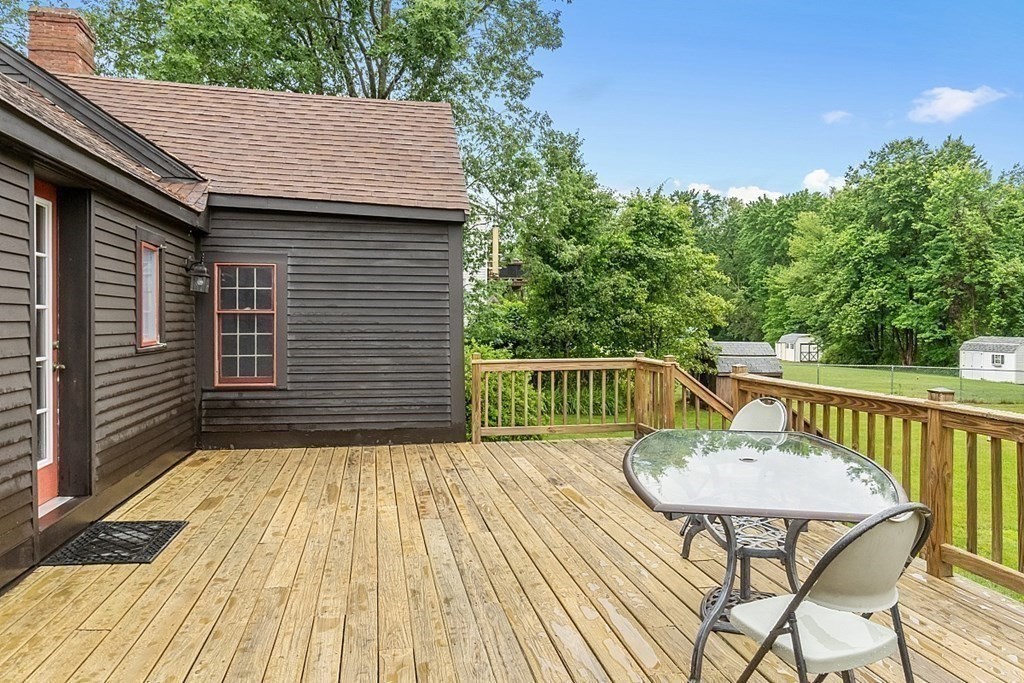 7 Groton-Shirley Road Ayer, MA 01432 - Photo 35 of 42 a view of a deck with wooden floor and seating space