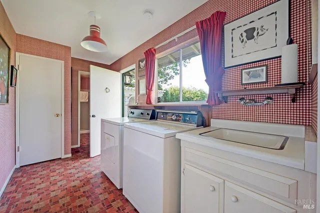 a view of kitchen with furniture and large window