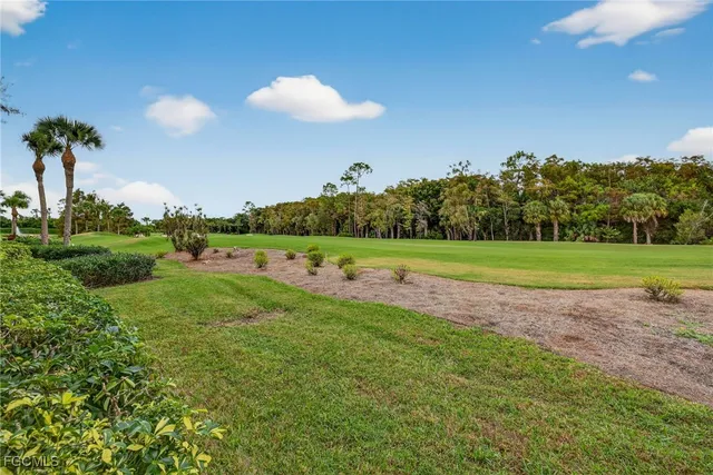 a view of a golf course with a lake