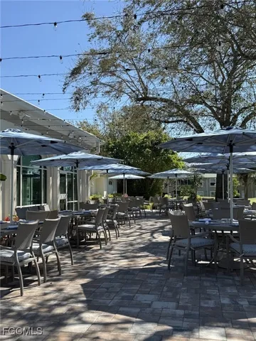 a building outdoor space with patio furniture and wooden floor
