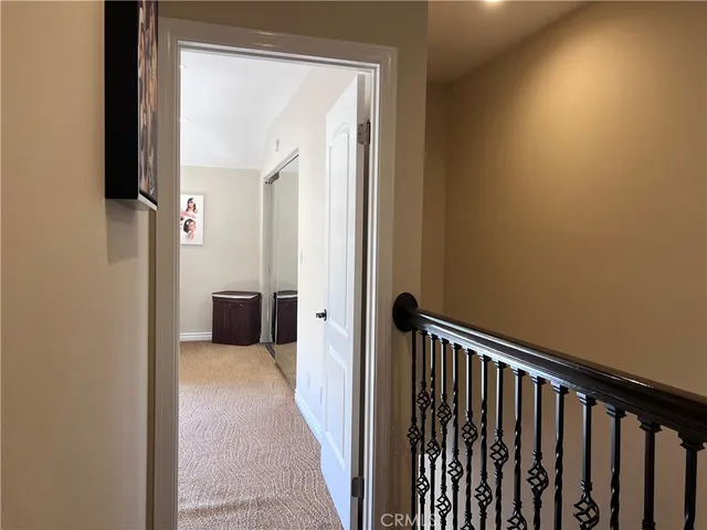 a view of a hallway with a dining room