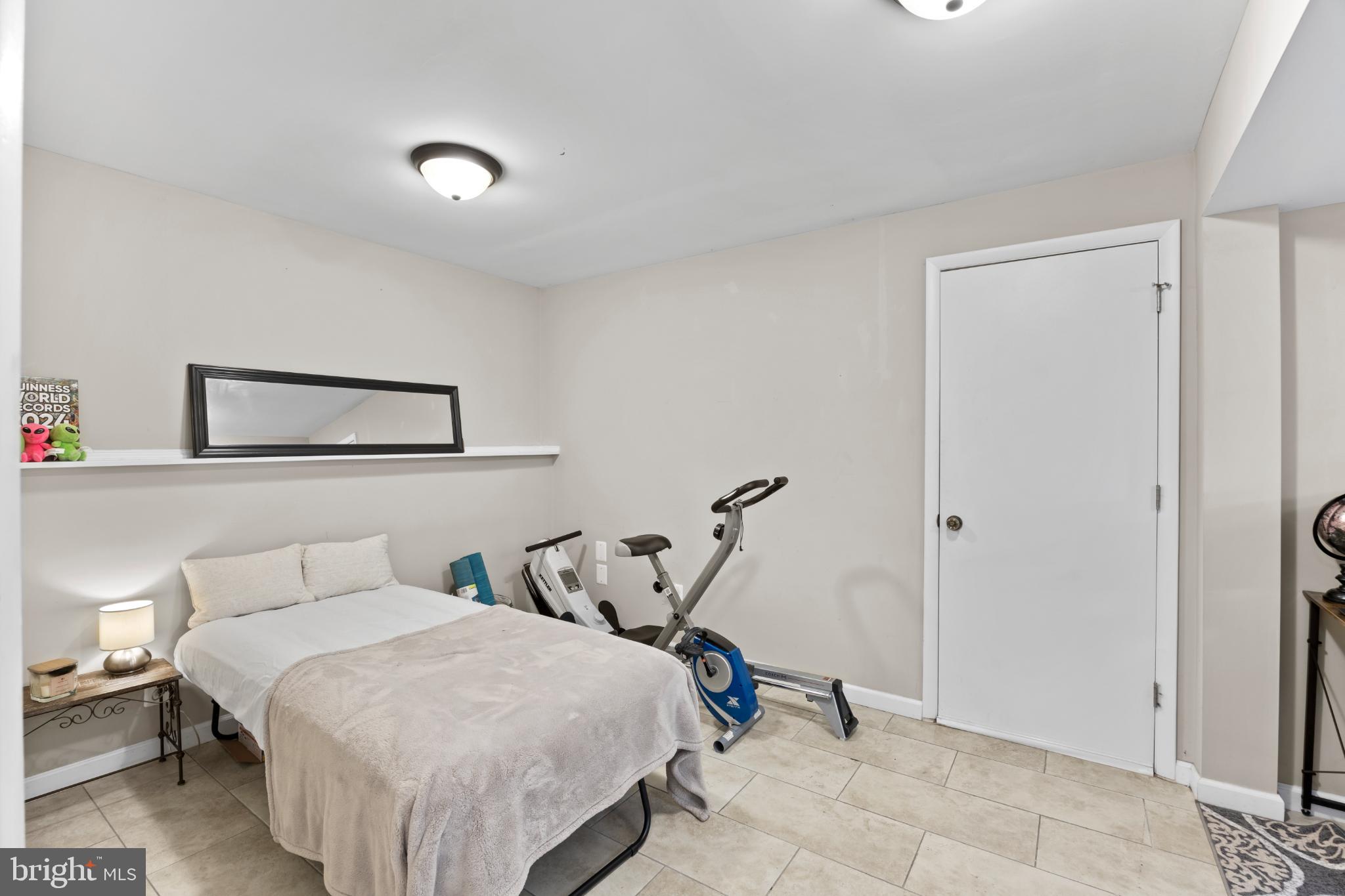 8600 Temple Hill Road Clinton, MD 20735 - Photo 17 of 31 a bedroom with a bed and a painting on the wall