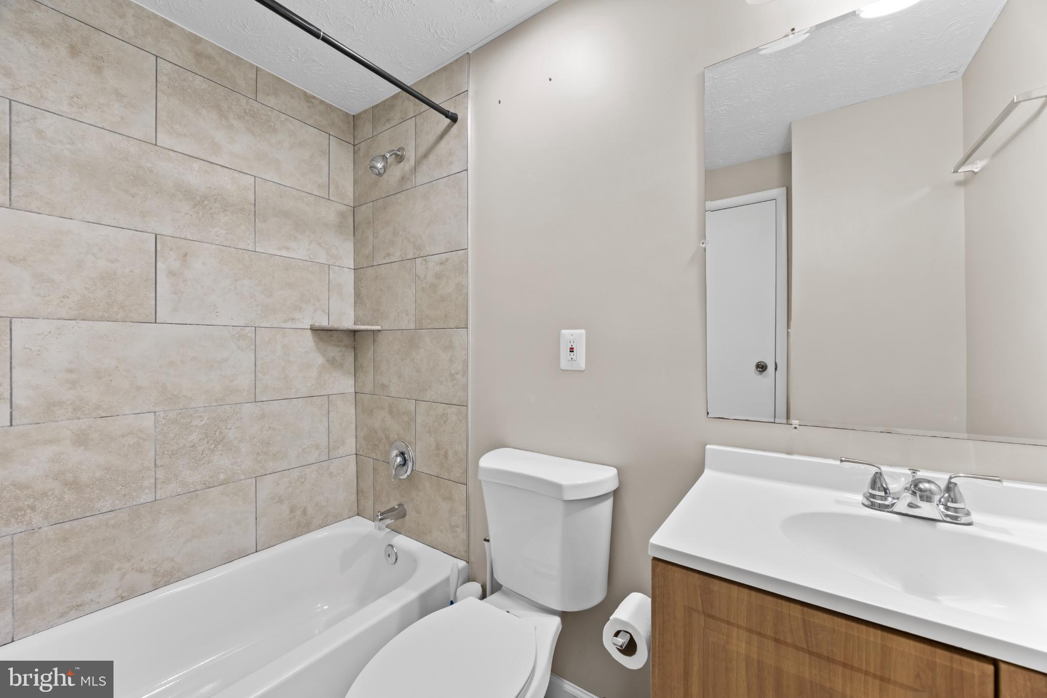 8600 Temple Hill Road Clinton, MD 20735 - Photo 24 of 31 a bathroom with a sink a toilet and shower