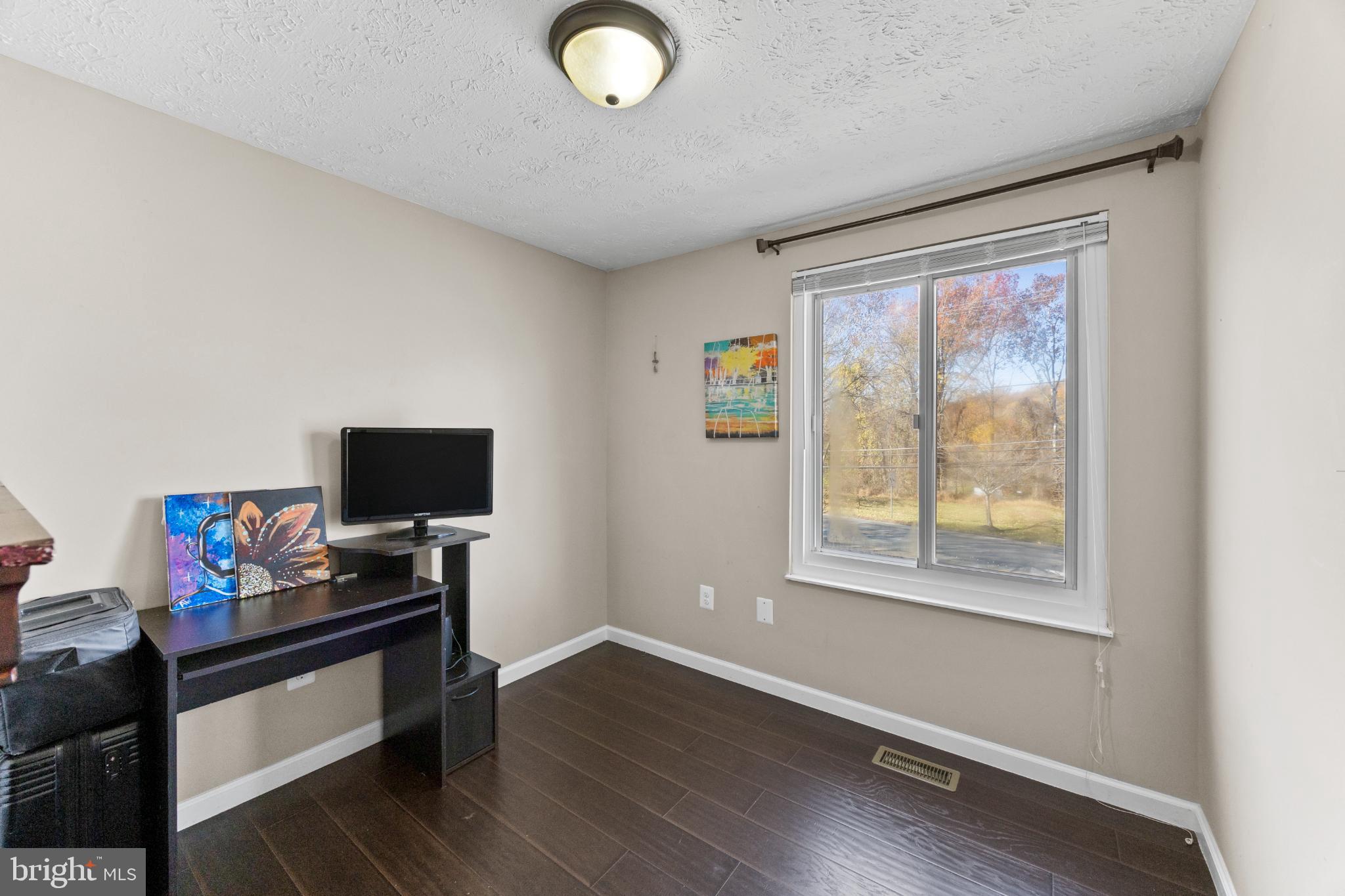 8600 Temple Hill Road Clinton, MD 20735 - Photo 27 of 31 a view of a workspace with furniture and a window