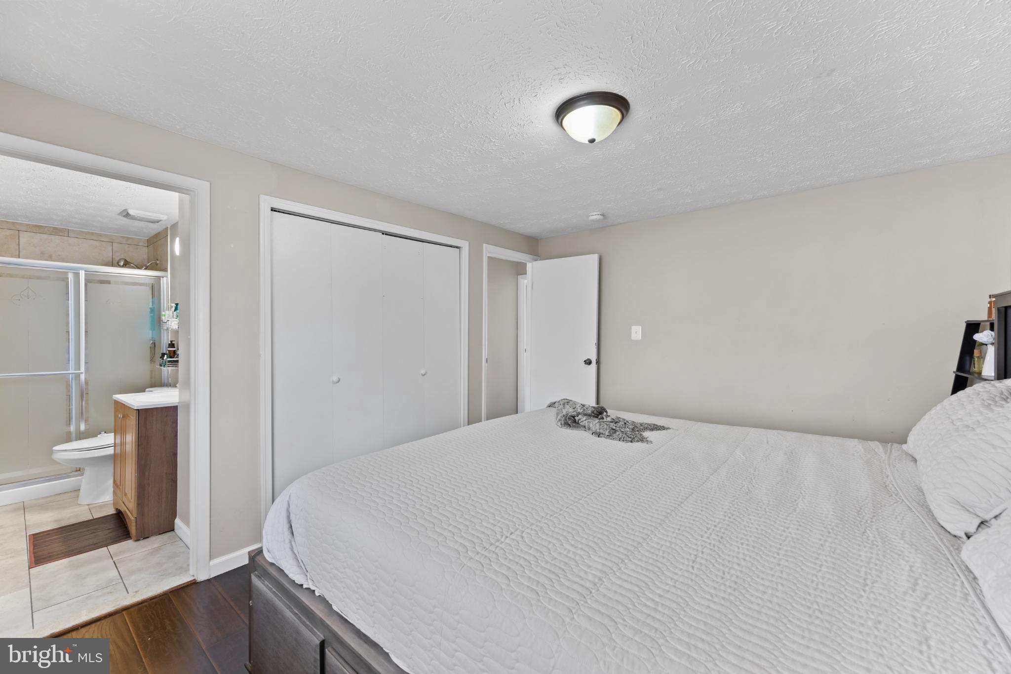 8600 Temple Hill Road Clinton, MD 20735 - Photo 28 of 31 a bedroom with a bed and a toilet