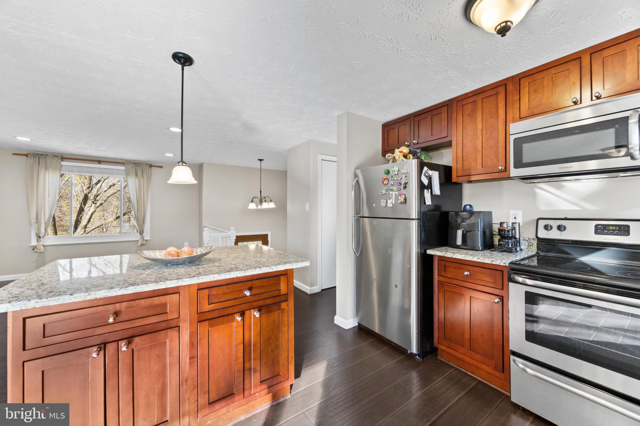 8600 Temple Hill Road Clinton, MD 20735 - Photo 9 of 31 a kitchen with stainless steel appliances granite countertop a refrigerator a stove and a sink