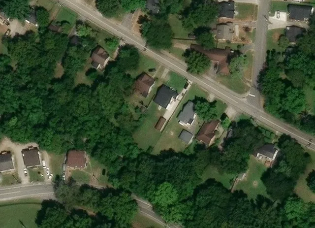 an aerial view of house with yard