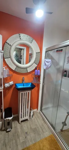 a kitchen with lots of counter top space and a wooden floor