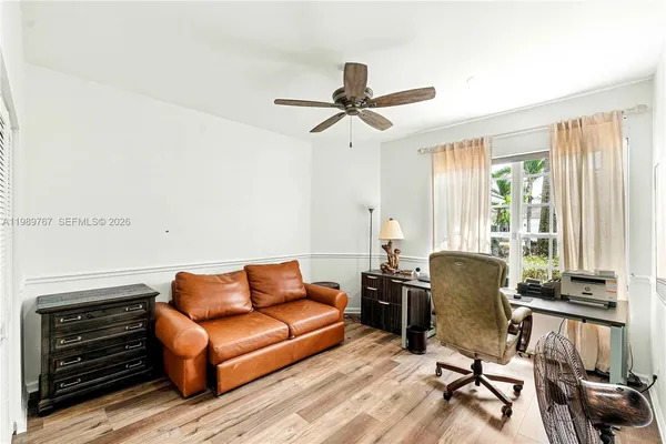a work room with furniture and a window