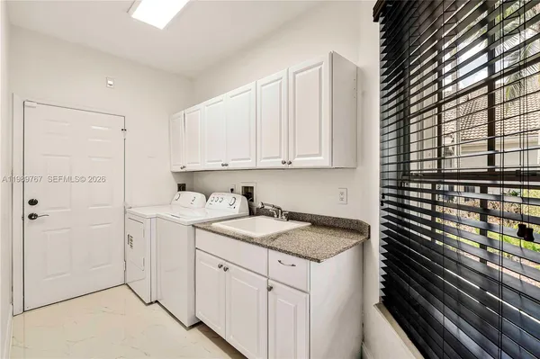 a kitchen with a sink and cabinets