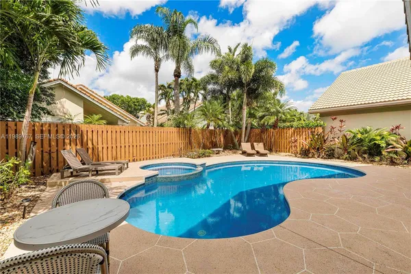 a view of a swimming pool with a patio