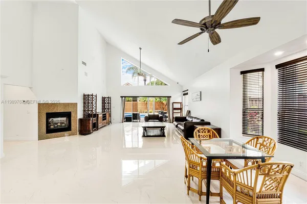 a view of a livingroom with furniture and a fireplace