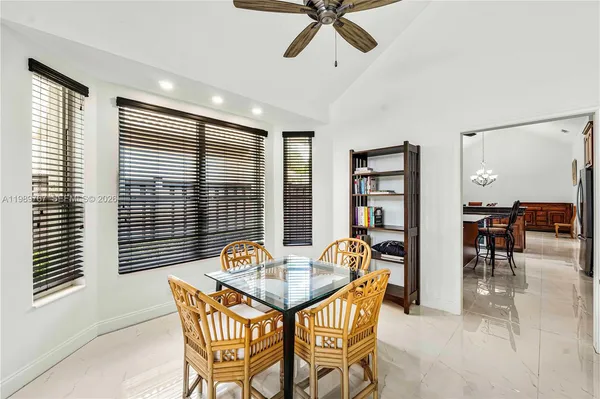 a dining room with furniture and window